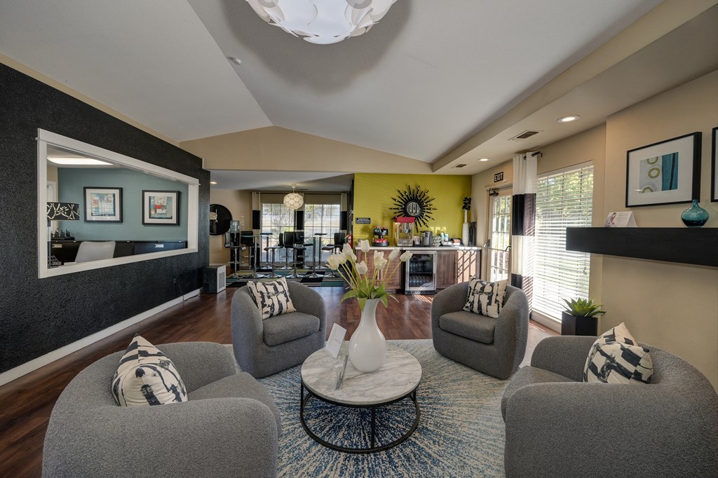 Rocklin manor Leasing office seating/lounge area with four cushioned swivel chairs