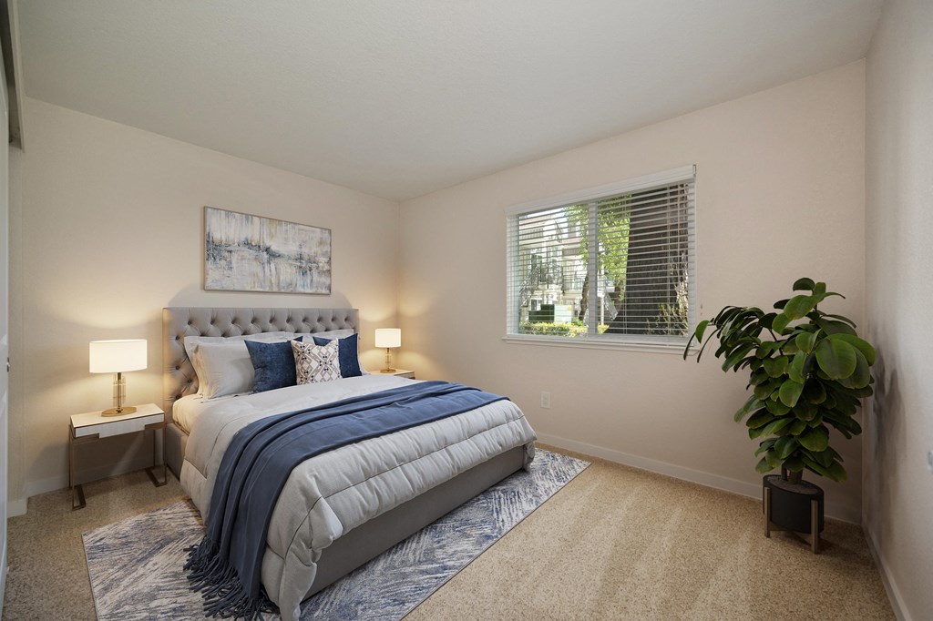a bedroom with a bed and a window at Rush River Apartments, Sacramento, CA, 95831