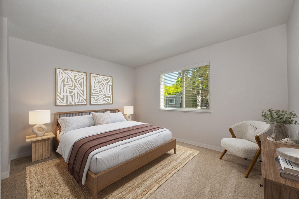 a bedroom with a bed and a window a bedroom with a bed and a window at Rush River Apartments, Sacramento, 95831