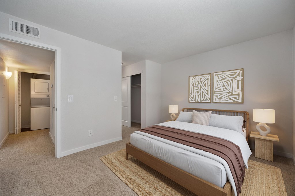 a bedroom with a bed and a closet at Rush River Apartments, California