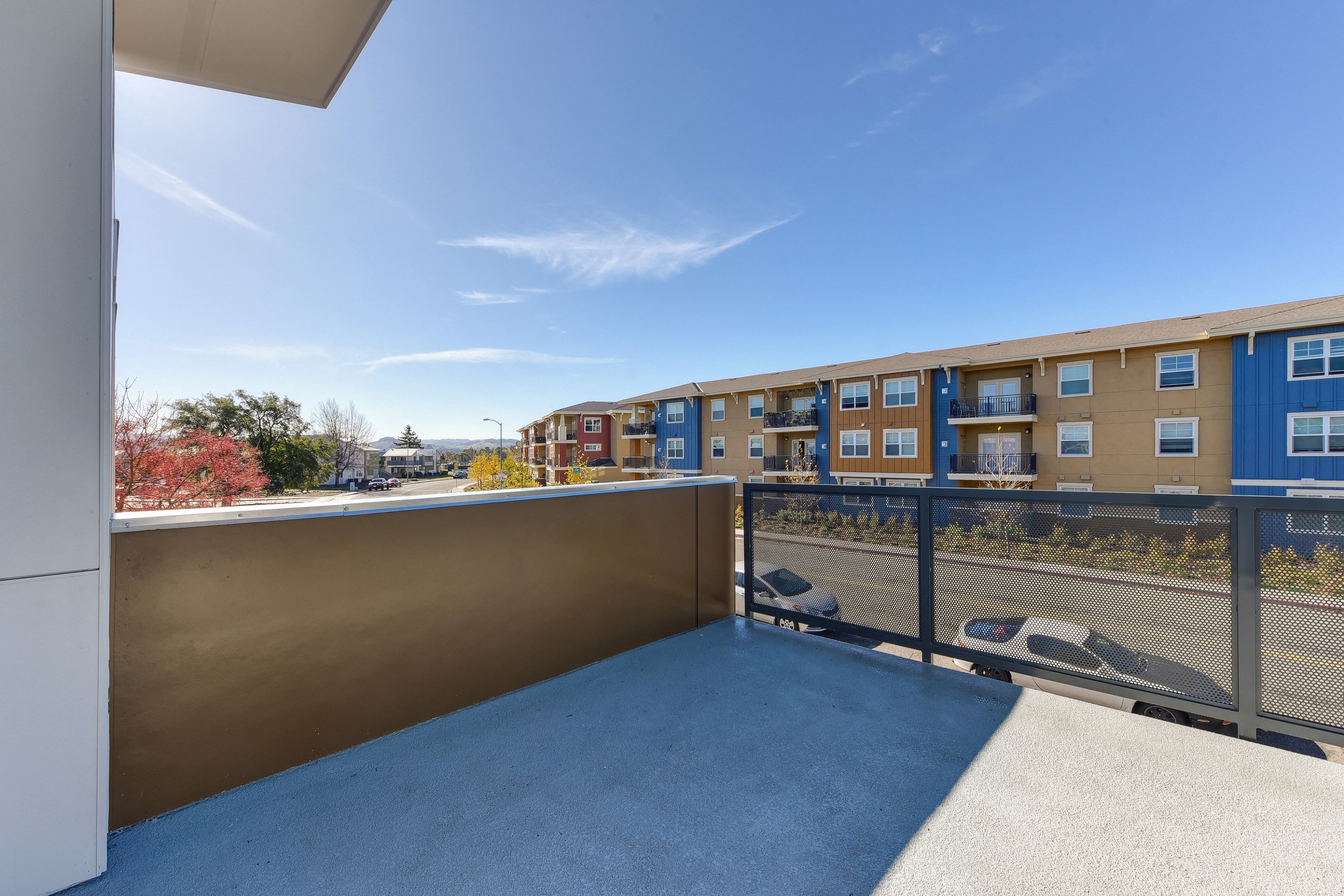 Outside Space Semi Private Entry Private Entrance with View of Road, Cars, and Exterior Apartments at Addison Ranch Apartments, Petaluma, CA