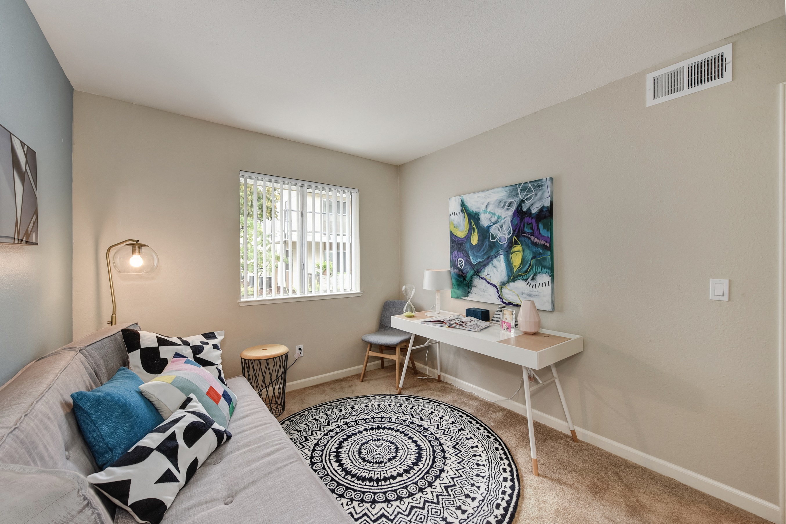 Spare Bedroom with Desk, painting and window with Black/White designed Rug at Addison Ranch Apartments, Petaluma