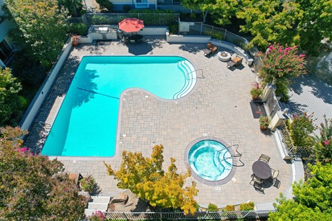 An aerial view of the Retreat swimming pool and spa area with lounge options.