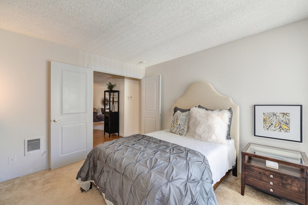 a bedroom with a bed and a nightstand at The Retreat at Walnut Creek, California