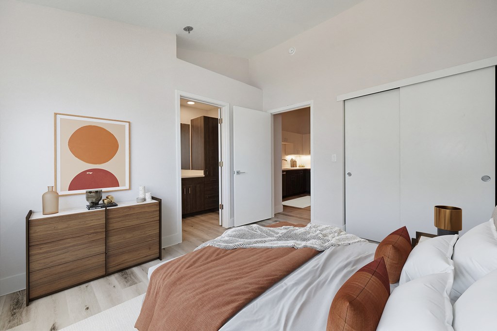 a bedroom with a bed and a closet and a bathroom  at Track 281 Apartments, Sacramento, 95811