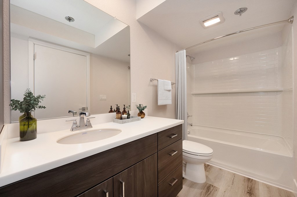 Track 281 2 bed, 2 bath home bathroom with sink, toilet and shower/tub enclosure. at Track 281 Apartments, Sacramento, CA