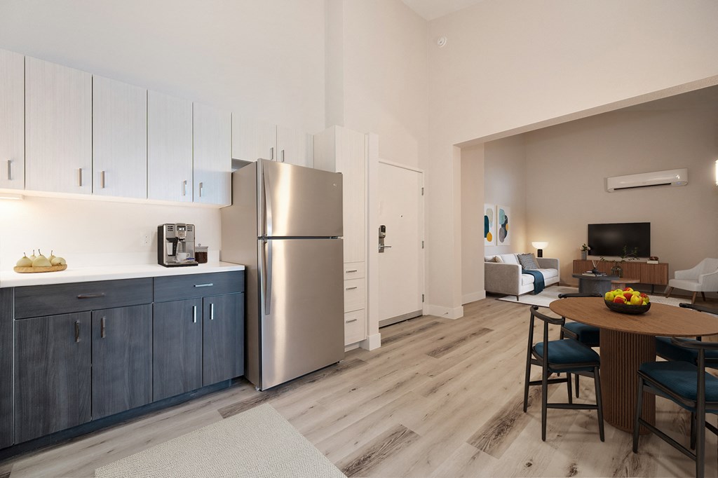 a kitchen and living room with stainless steel appliances and a wooden floor  at Track 281 Apartments, Sacramento, CA, 95811
