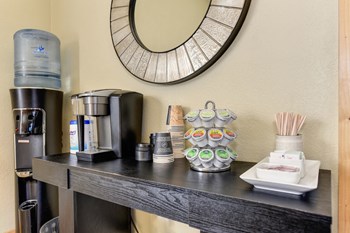 Coffee bar and water refill station located in the community leasing office.  - Photo Gallery 36