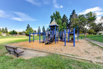 Nearby neighborhood park with play structure and mature trees and landscaping.  - Photo Gallery 38