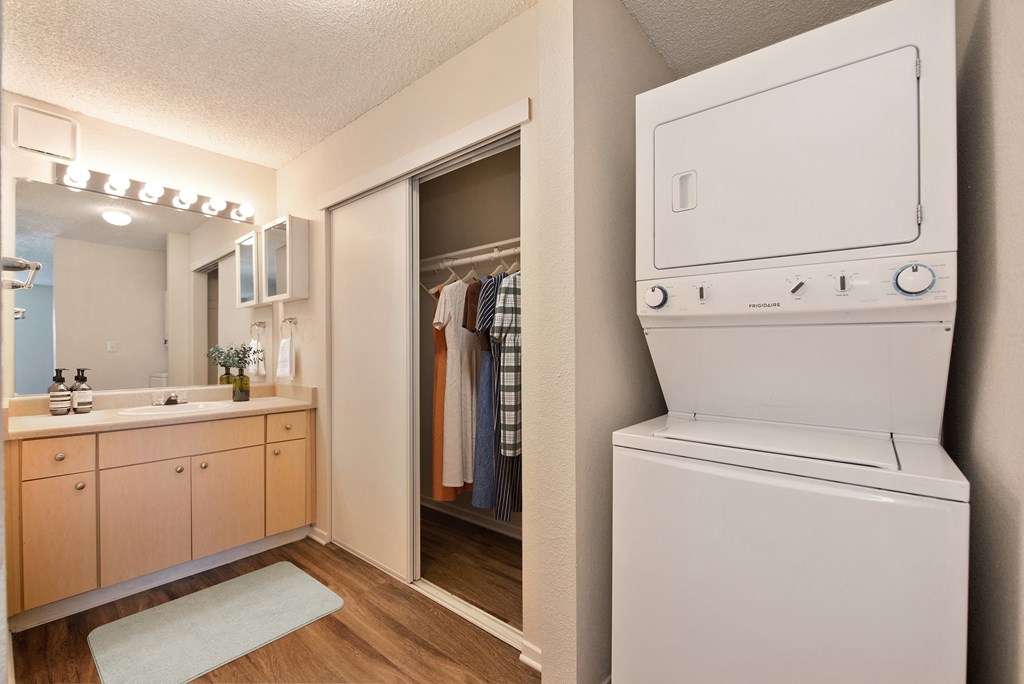 the preserve at ballantyne commons apartment laundry room with washer and dryer at Vineyard Terrace Apartments, California