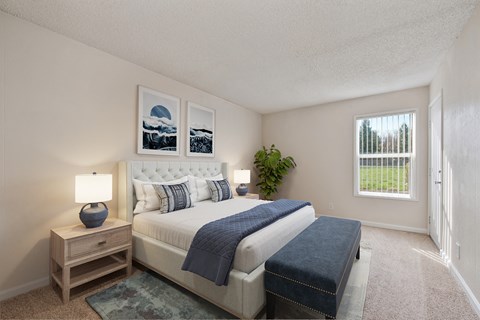 the preserve at ballantyne commons bedroom with bed and window at Vineyard Terrace Apartments, California