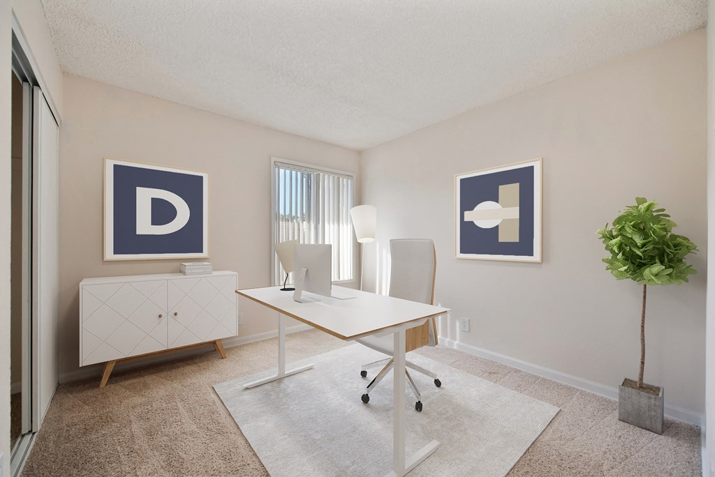 A spare bedroom used as an office  with a desk and a window at Vineyard Terrace Apartments, Napa, CA