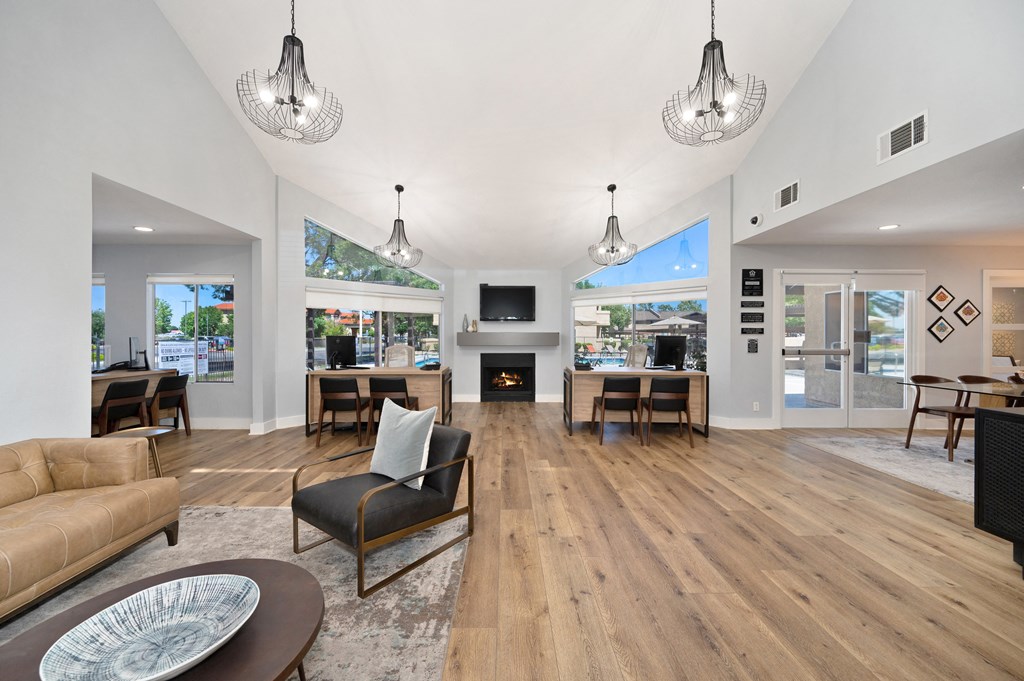 a living room with couches and chairs and a fireplace