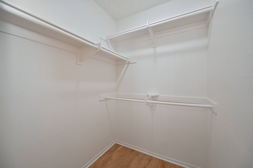 the preserve at ballantyne commons empty walk in closet with white walls and shelves