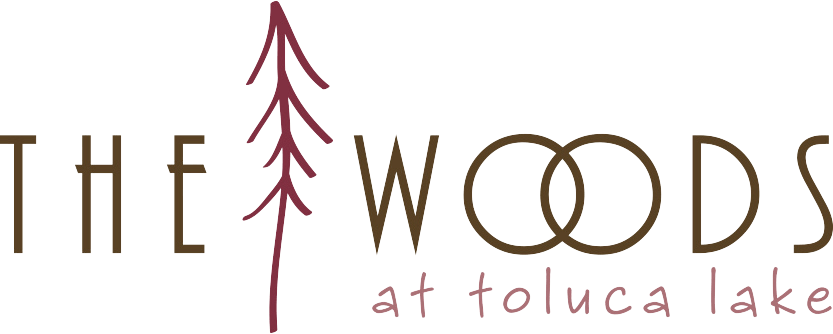The Woods At Toluca Lake community logo with tree icon.  Colors used are brown and darker pink.
