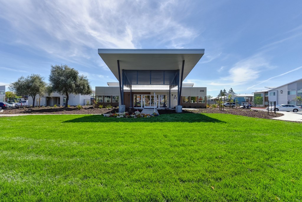 Apartment Exterior with Grass, Trees, Walking Path, Cars at Addison Ranch Apartments, Petaluma, California