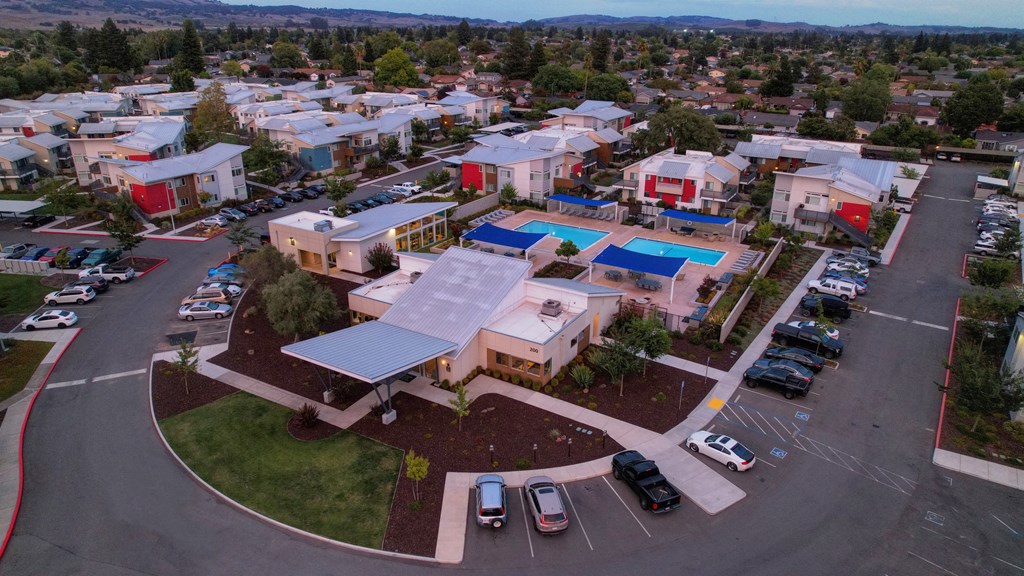 an aerial view of a building with a large solar panel on the roof at Addison Ranch Apartments, Petaluma, CA