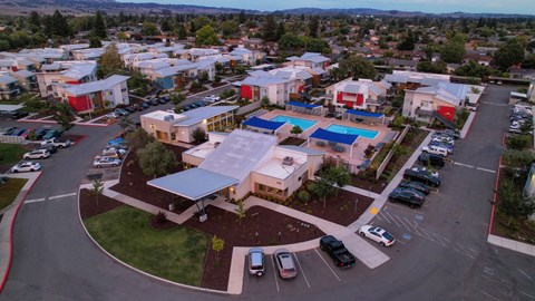an aerial view of a building with a large solar panel on the roof an aerial view of a building with a large solar panel on the roof at Addison Ranch Apartments, Petaluma, CA