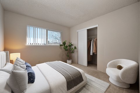 a bedroom with a bed and a closet