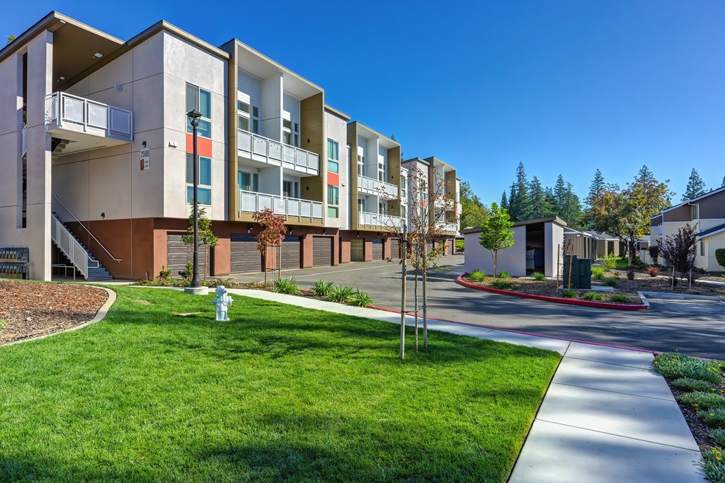 Apartment complex with a fire hydrant in front of it.