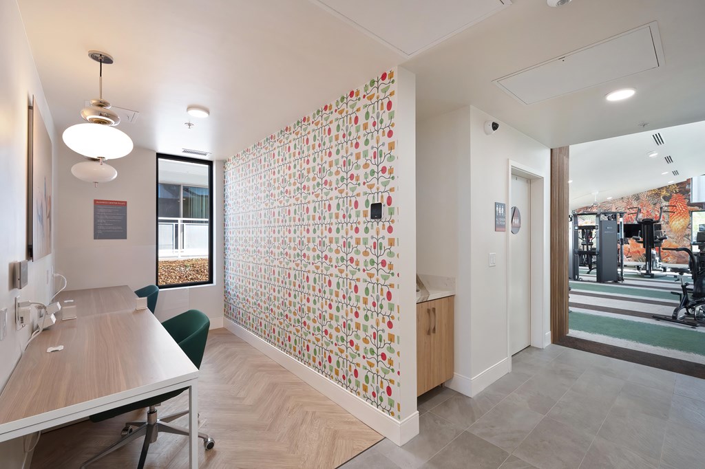 A conference room with a long table and chairs.