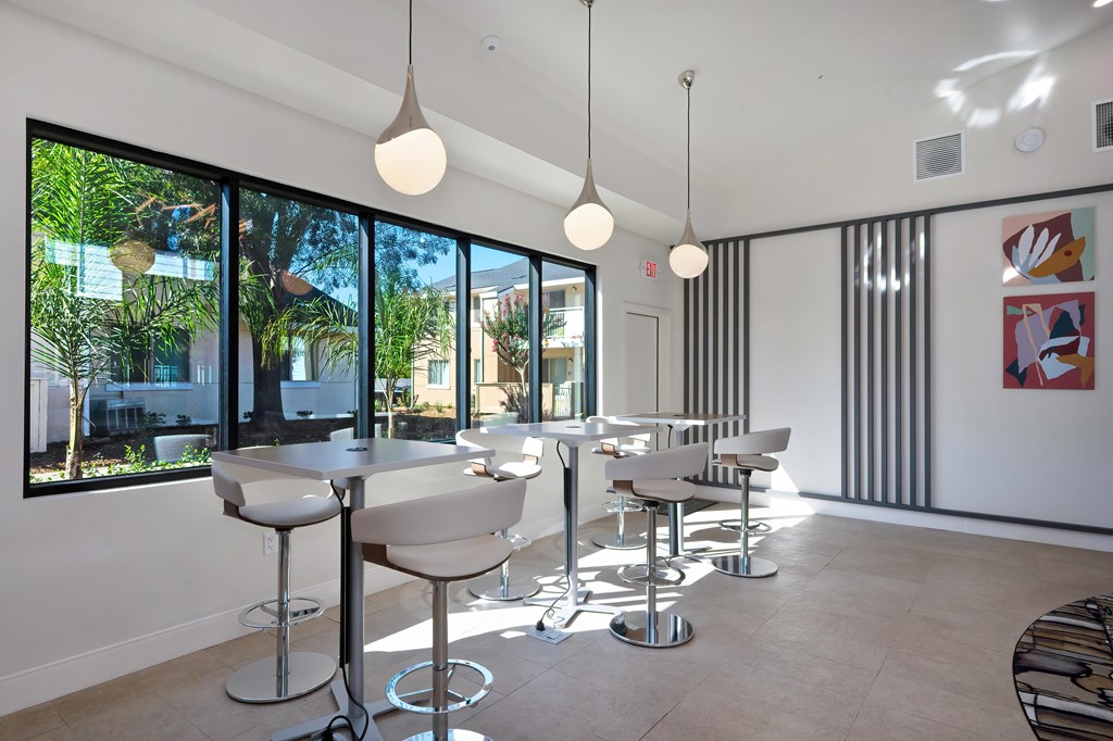 A white room with a table and chairs.