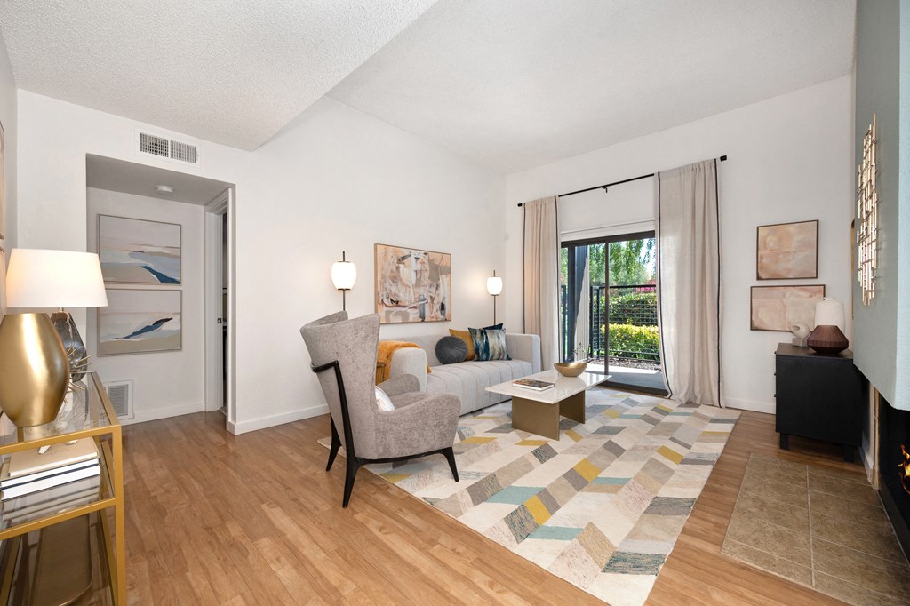 a living room with hardwood floors and a sliding glass door at Fountains of Fair Oaks, Fair Oaks, CA 95628