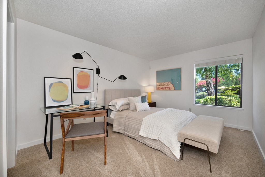 a bedroom with a bed and a desk with a chair at Fountains of Fair Oaks, Fair Oaks, 95628