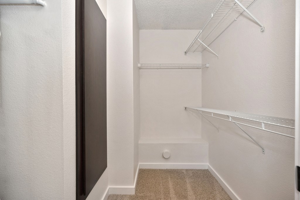 a extended large closet with lots of shelving and hanging racks at Fountains of Fair Oaks, Fair Oaks California
