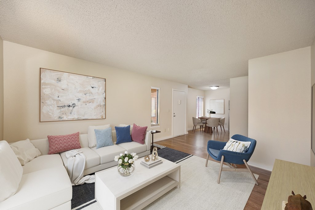 a living room with a white couch and a coffee table at Fountains of Fair Oaks, California