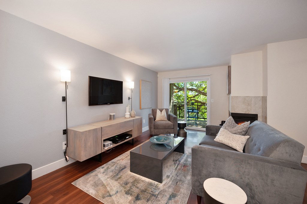 a living room with a gray couch and a tv at Folsom Ranch, California, 95630
