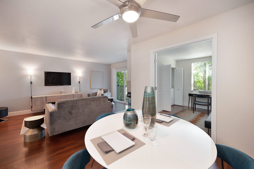 a living room with a white table and a ceiling fan at Folsom Ranch, California, 95630