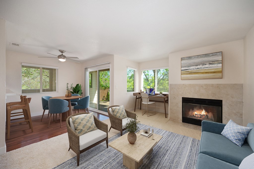 a living room with a fireplace and a table with chairs at Folsom Ranch, California, 95630