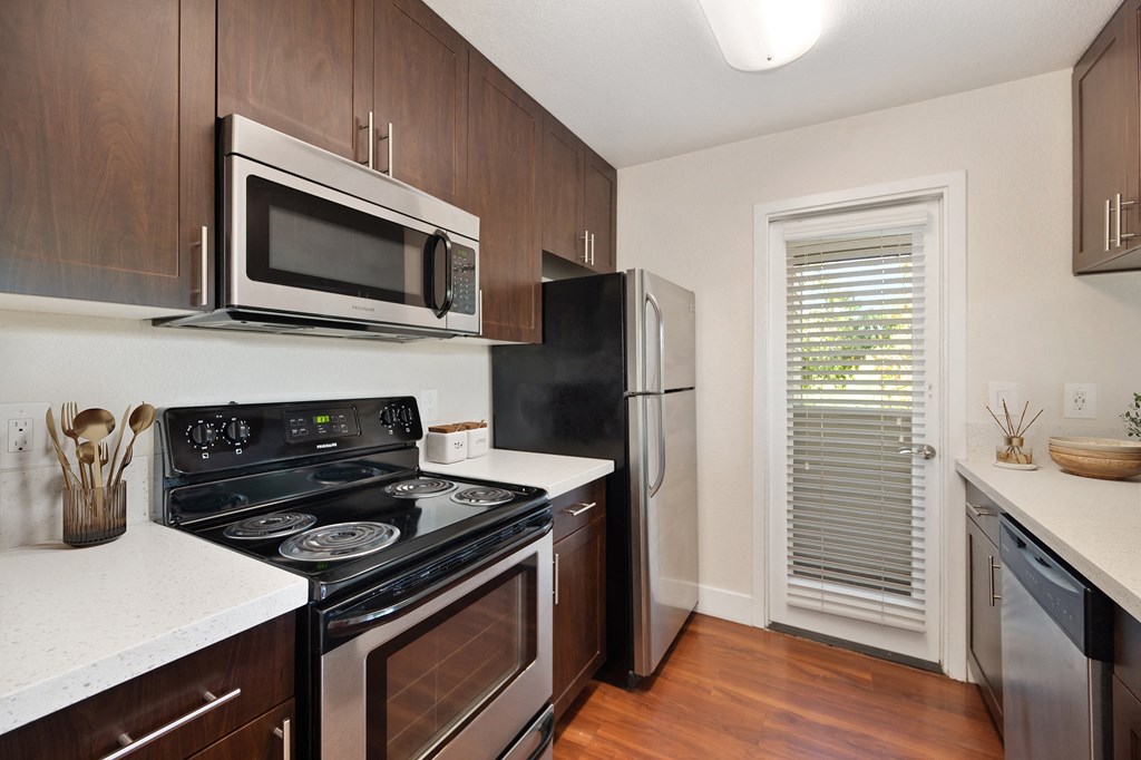 a kitchen with a stove microwave and refrigerator at Folsom Ranch, California