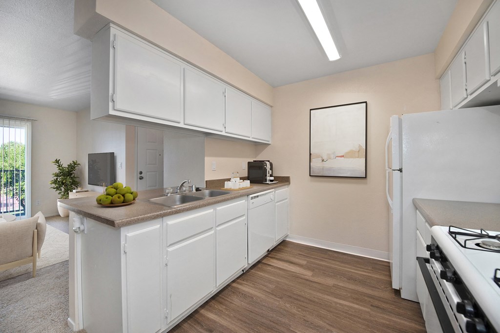 Open Kitchen a kitchen with white cabinets and a sink and a refrigerator