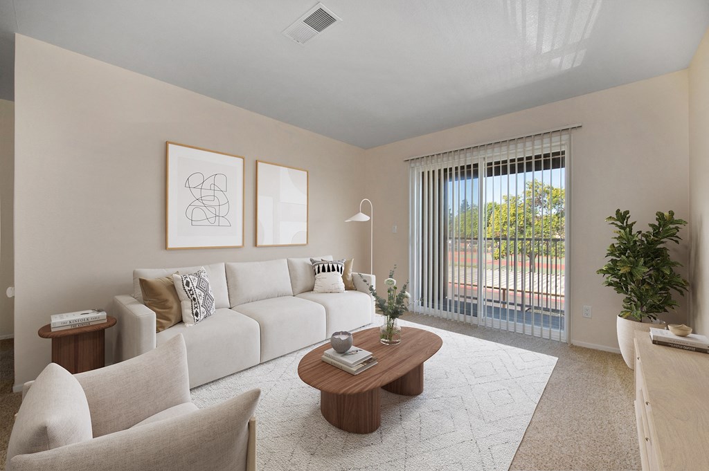 a living room with a white couch and a coffee table