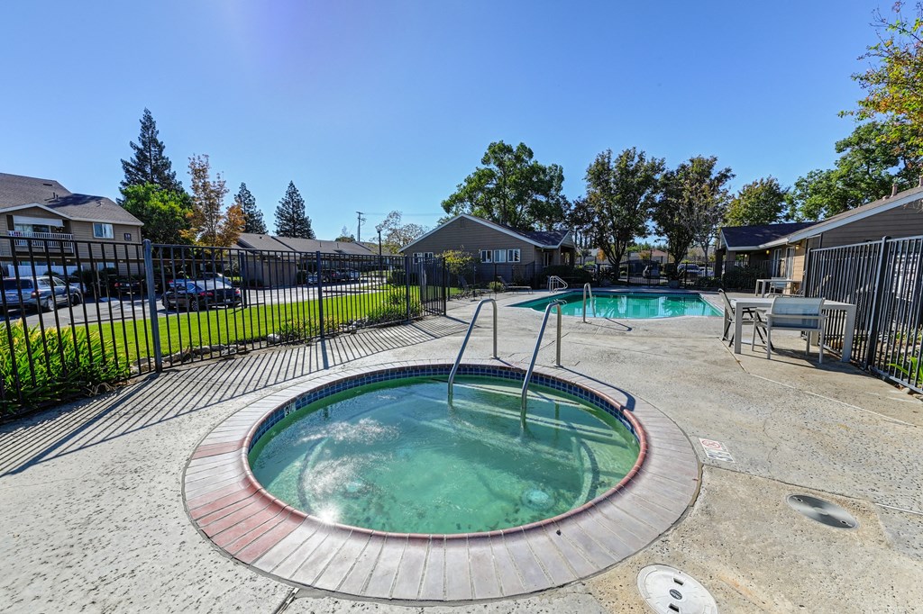 take a dip in the hot tub at the enclave at woodbridge apartments in sugar land,