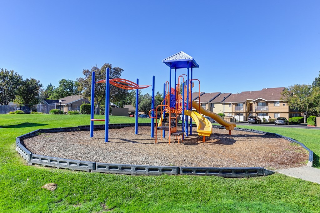 Playground On-site Playground on-site with slides and monkey bars surrounded by large grassy area