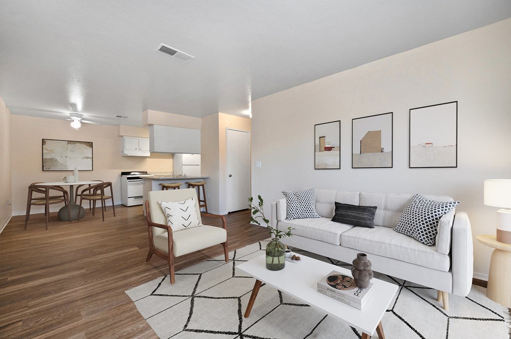 a living room with a white couch and a table