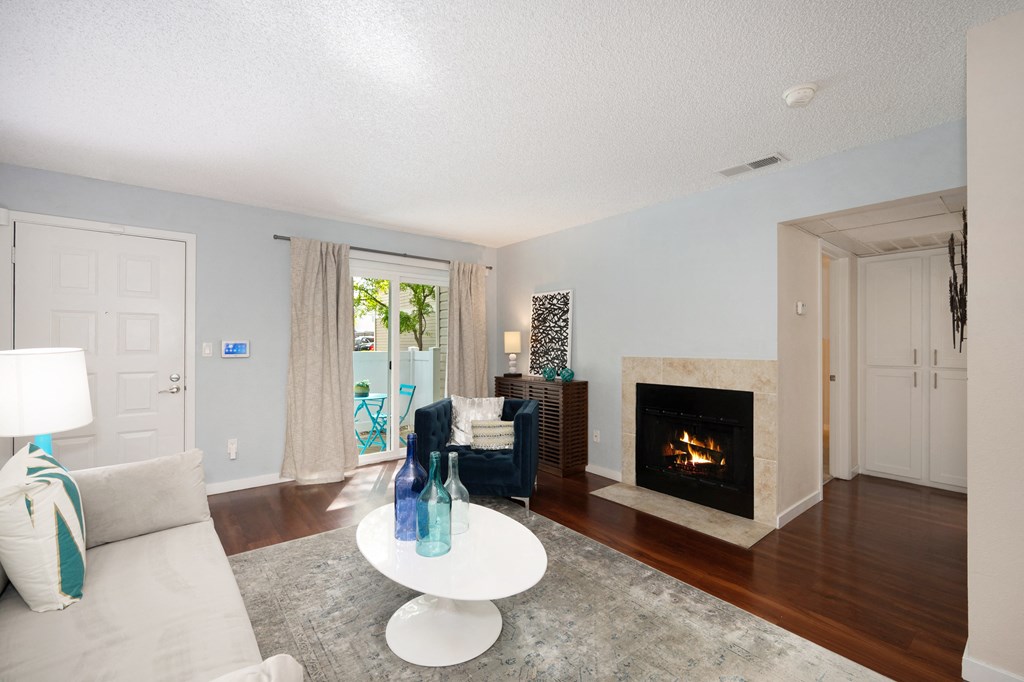 Spacious Living Room with Hardwood Flooring and Stylish Interior Showing Natural Light at Hidden Oaks Apartments, Citrus Heights, CA