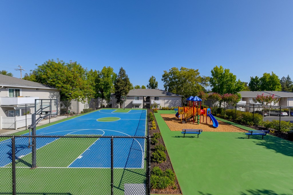 Basketball Court On-site with playground right next to it.at The Renaissance Apartments, Citrus Heights