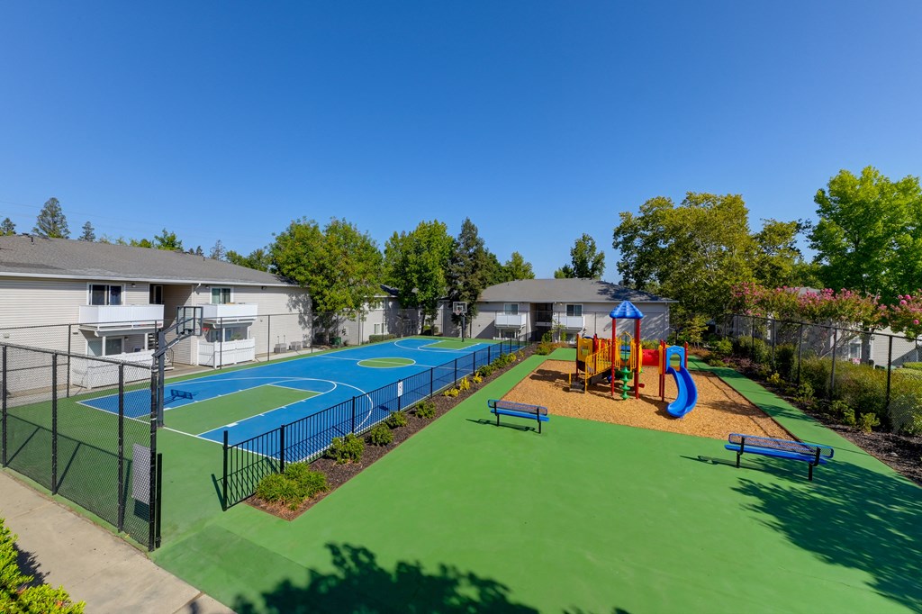 Basketball Court On-site with playground right next to it.at The Renaissance Apartments, California