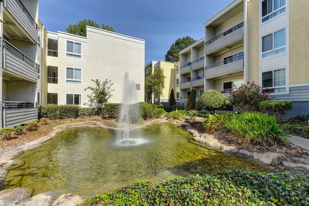 Water fountain on-site located in between two community apartment buildings at The Retreat at Walnut Creek, Walnut Creek, 94596