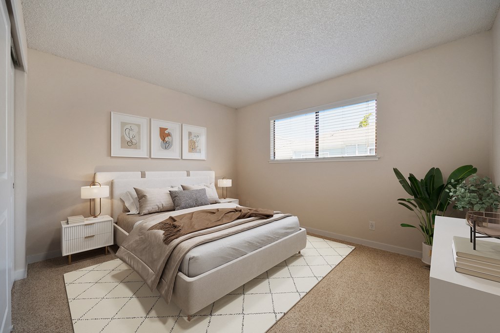 a bedroom with a bed and a window at Silverstone Apartments, California