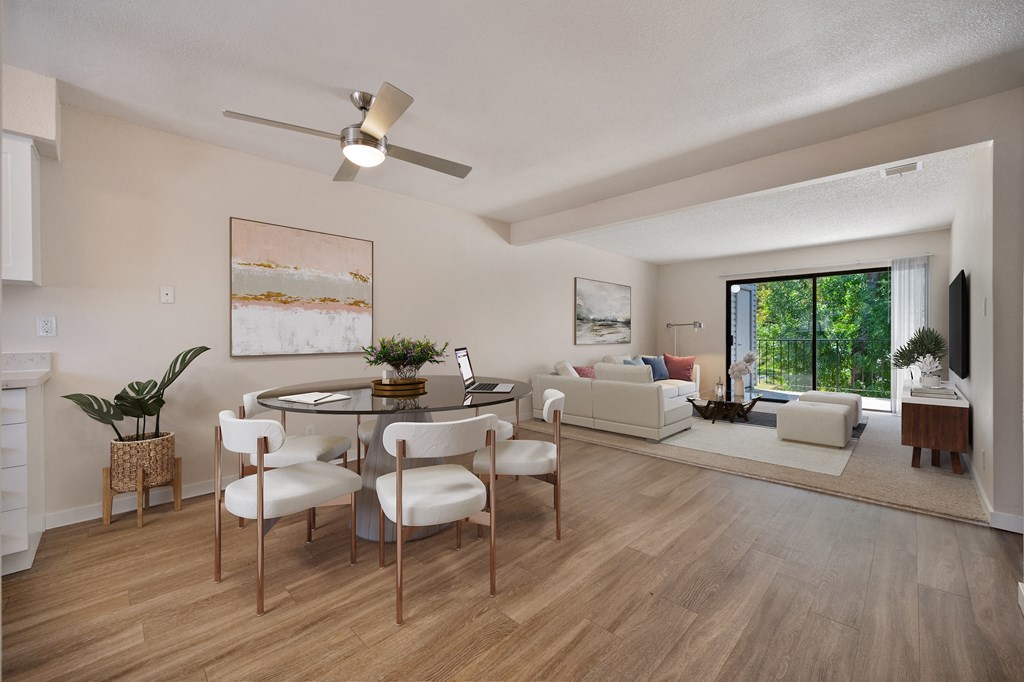 an open living room and dining room with a table and chairs at Silverstone Apartments, Davis, CA, 95618