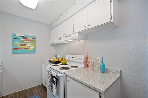 Kitchen with White Appliances at The Renaissance Apartments, California, 95610