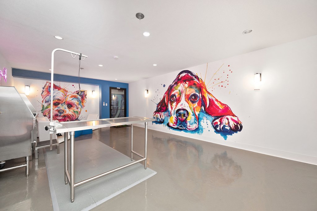 a hospital room with two large paintings of dogs on the wall  at Track 281 Apartments, Sacramento, CA, 95811