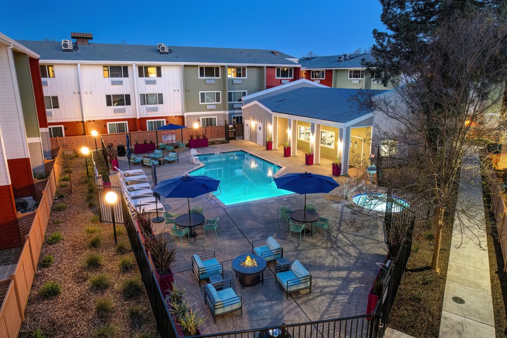 an aerial view of a swimming pool at night