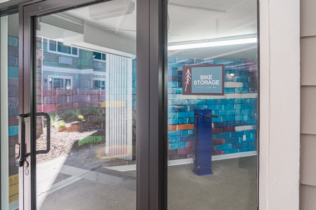 the entrance to the bike store with a sign in the door