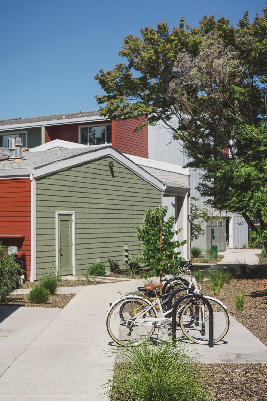 a group of bikes parked in front of a house